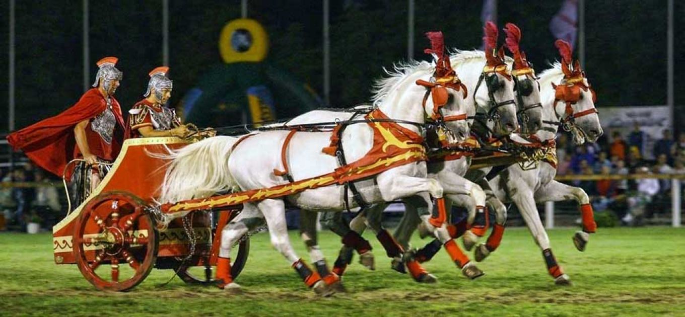 Nighttime equestrian show with Roman-era soldiers