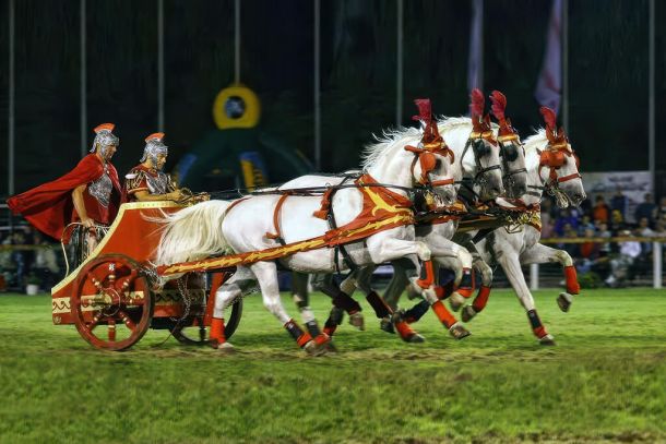 Nighttime equestrian show with Roman-era soldiers